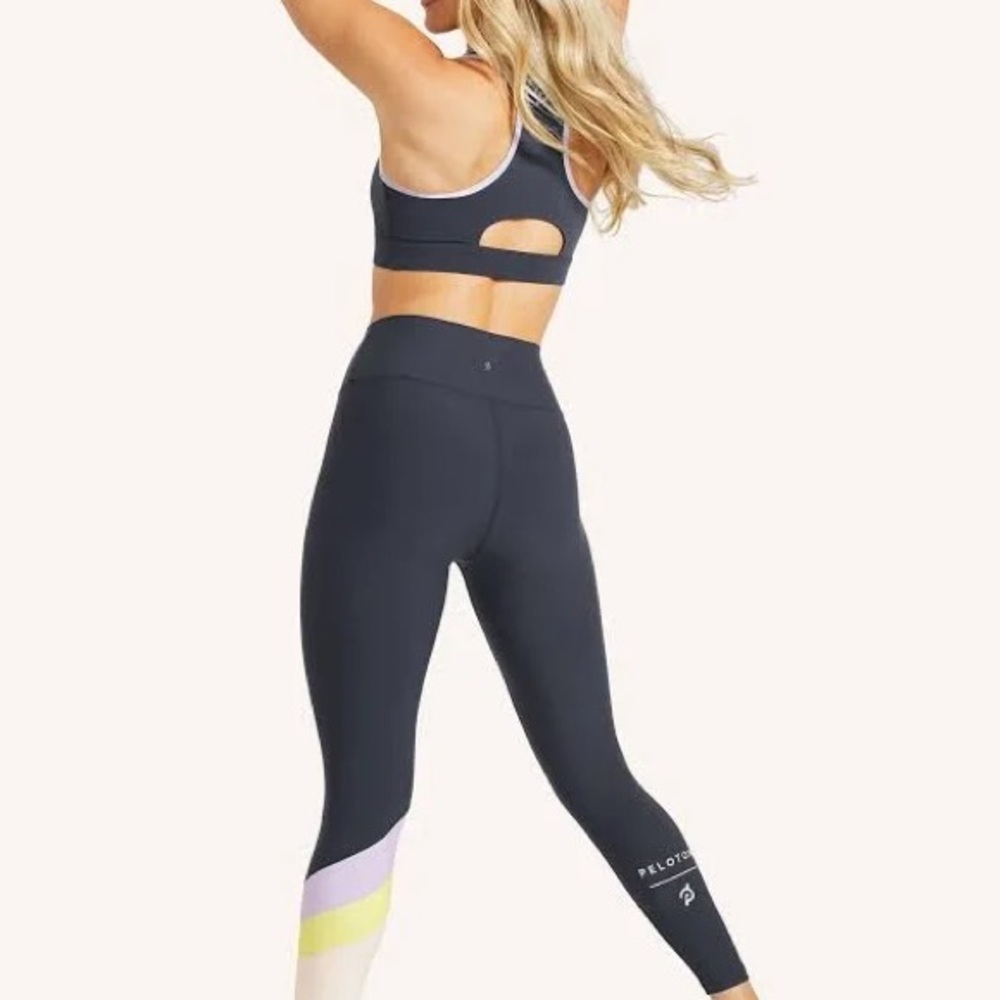 Peloton women’s Leggings in dark gray with white lettering on the bottom